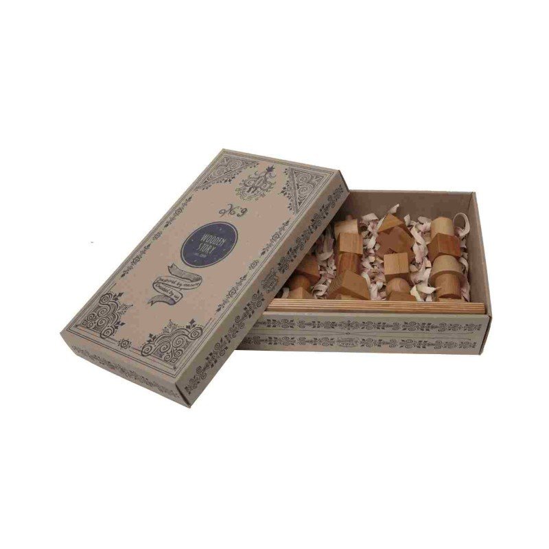 2. Open box of Wooden Fence Puzzle by Wooden Story showing natural wood blocks inside