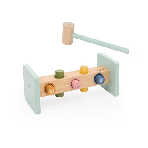 2. Studio shot of Trixie Baby wooden hammer bench with colorful animal pegs and light green sides