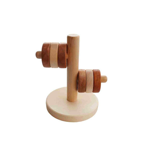 1. Wooden Story horizontal tower puzzle with natural wood finish, featuring six disks on a vertical pole, promoting motor skills and coordination for children