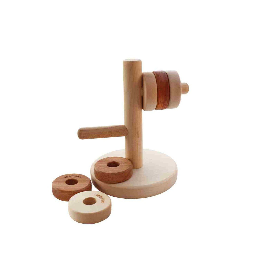 2. Wooden Story horizontal tower puzzle with removable disks, showcasing different hole sizes for adjustable difficulty, enhancing children's logical thinking