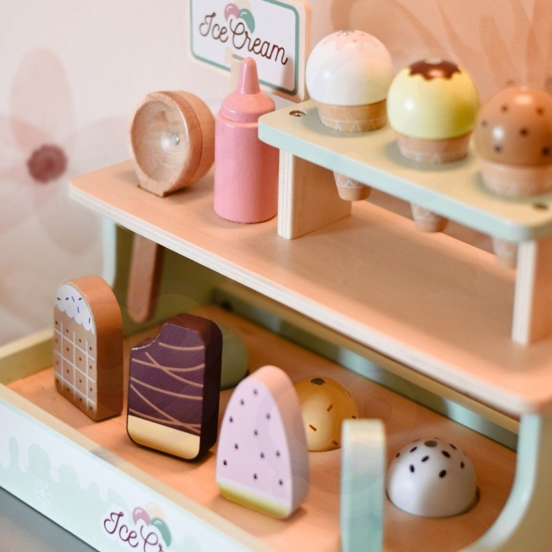 7. Close-up of Woopie Green ice cream stand with colorful popsicles and cones in a playroom