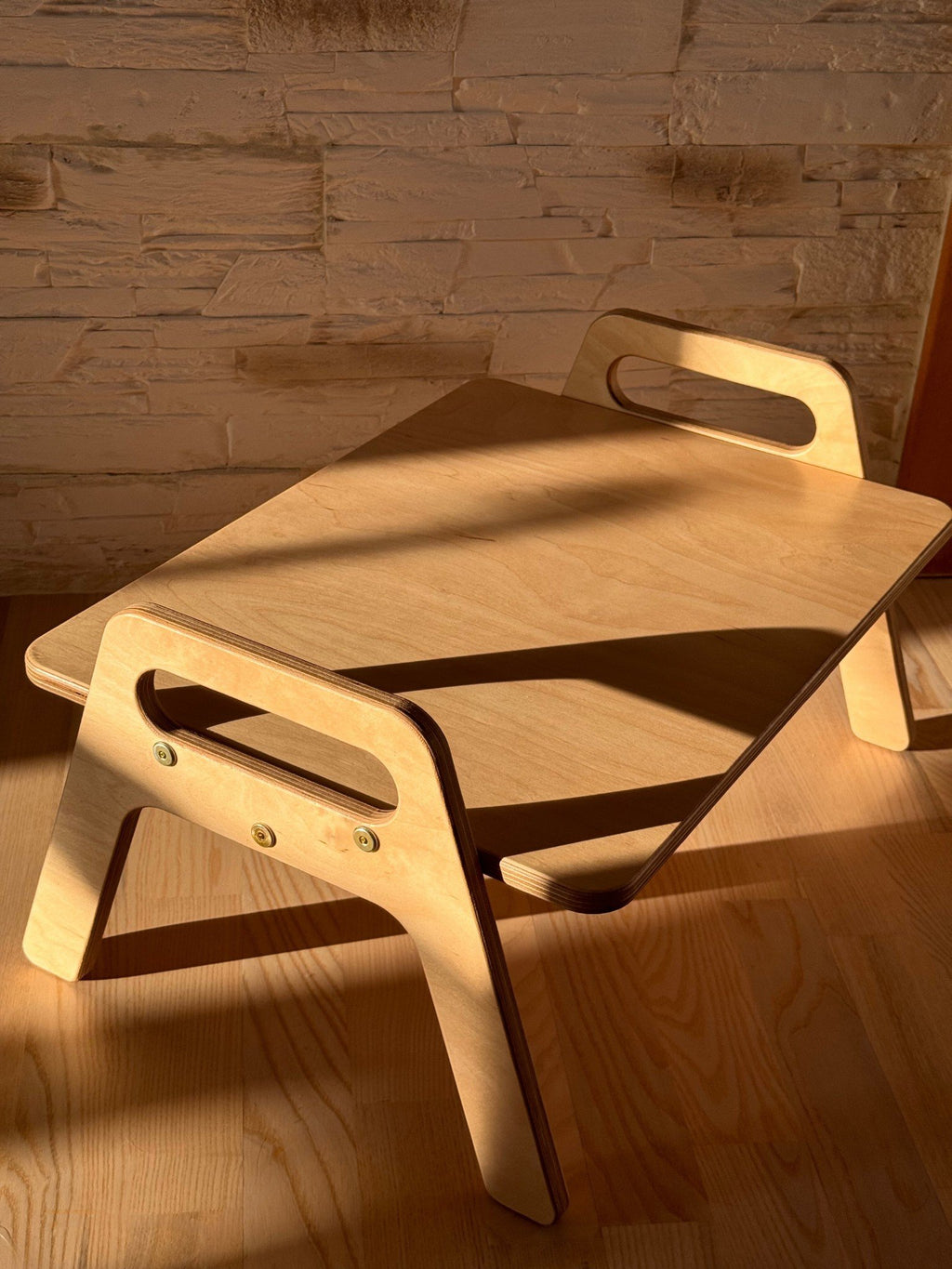 3. Close-up of wooden kids floor table highlighting smooth rounded edges and natural wood grain