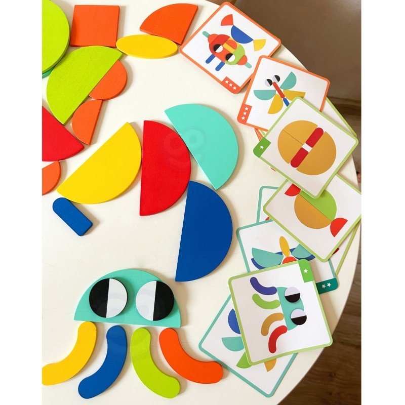 8. Various colorful wooden shapes and pattern cards on table