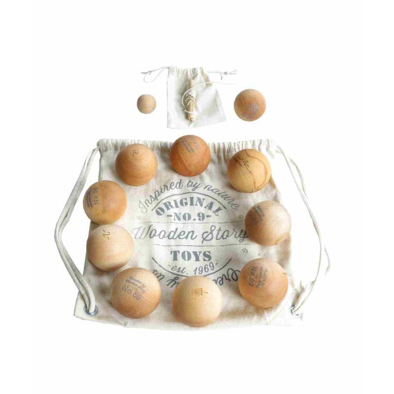 2. Flat lay of Wooden Story's wooden pétanque game set with eight wooden balls and one cochonnet on a branded drawstring bag