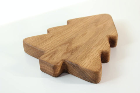 3. Back view of a wooden Christmas tree-shaped plate highlighting the smooth, polished finish