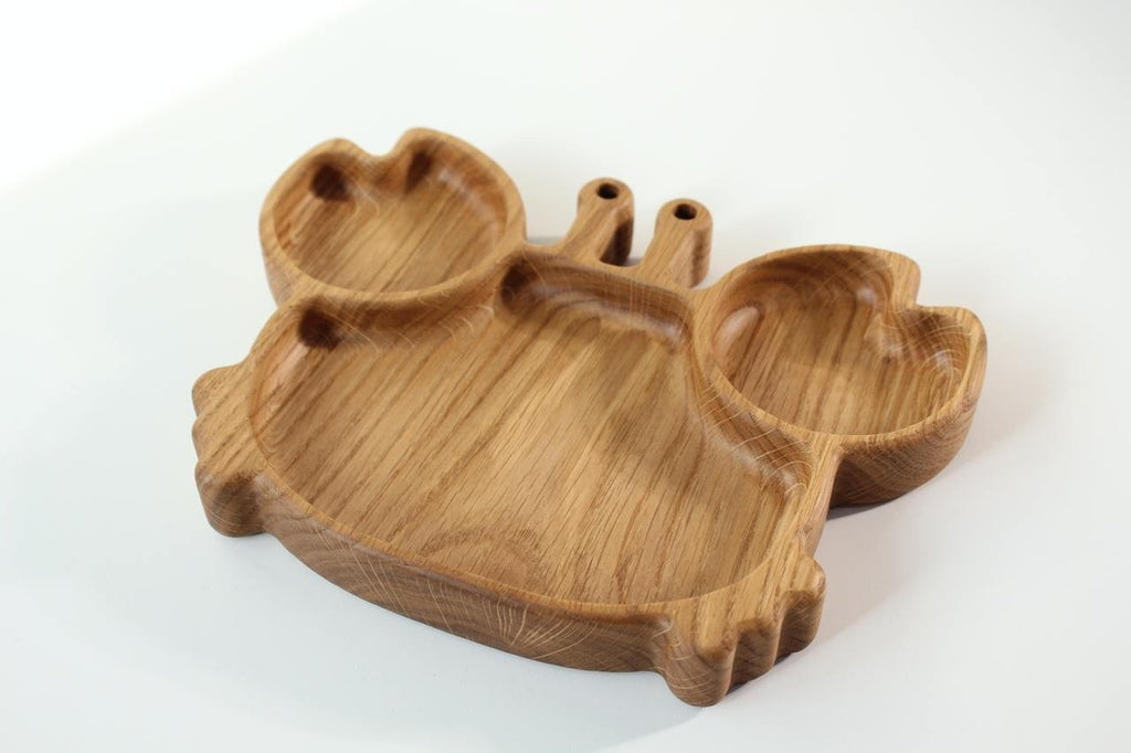 1. Handmade wooden crab-shaped plate for kids made of oak, shown on a white background highlighting its smooth finish and natural wood grain