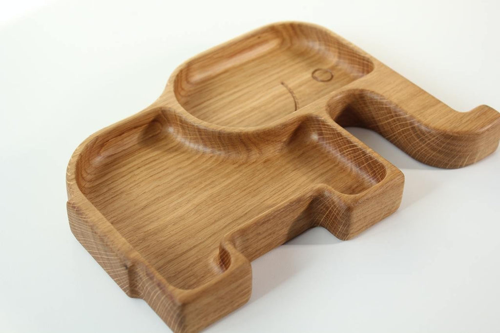 2. Wooden elephant-shaped kids plate with two sectors, highlighting the smooth, polished surface