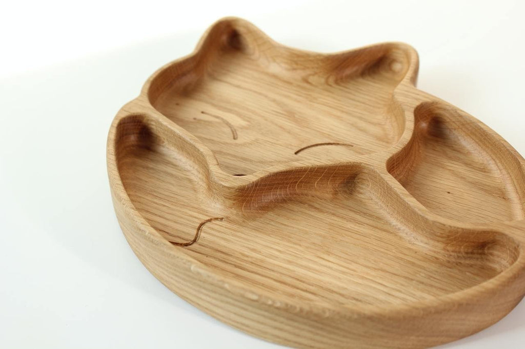 3. Close-up of wooden fox-shaped plate showing smooth, hand-polished surface and three distinct compartments