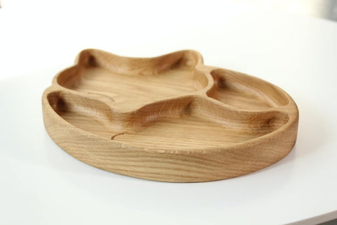 2. Side view of wooden fox-shaped plate with three compartments, highlighting the natural wood grain and smooth finish