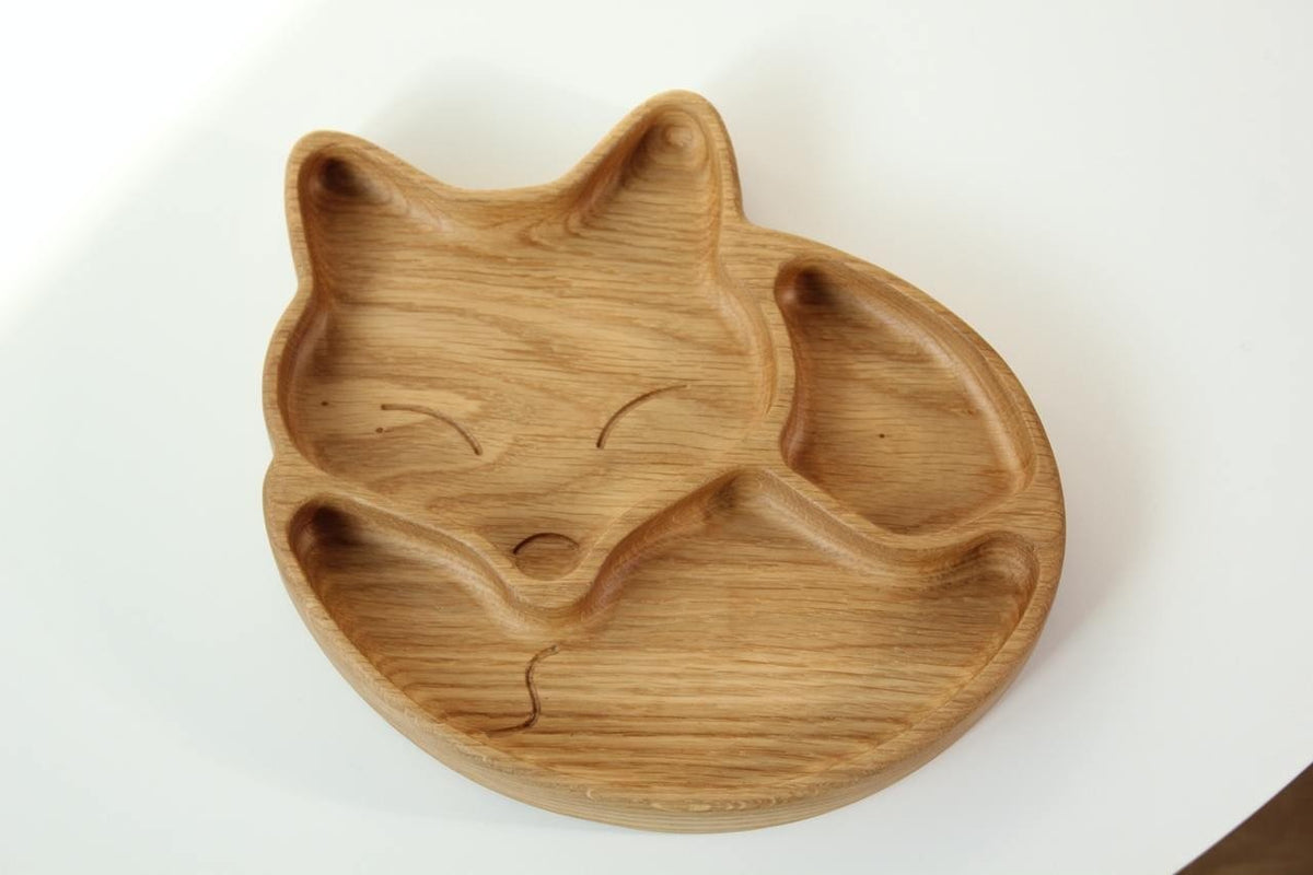 2. Top view of wooden fox-shaped plate with three compartments, showcasing the smooth, hand-polished surface