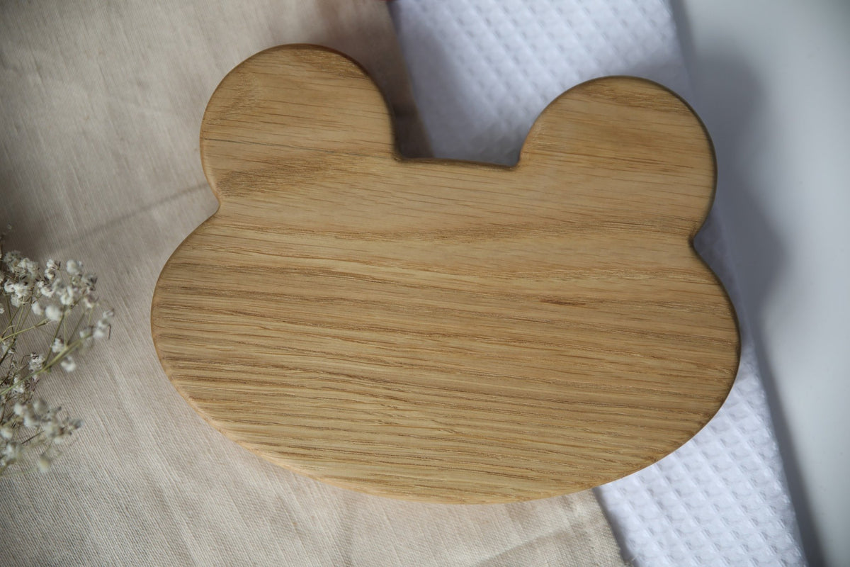 6. Back view of wooden frog-shaped plate showing smooth, polished oak surface