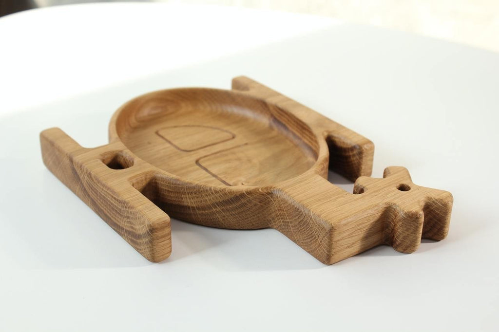 4. Side view of a wooden helicopter-shaped plate for kids, showcasing the smooth finish and natural wood grain, on a white background