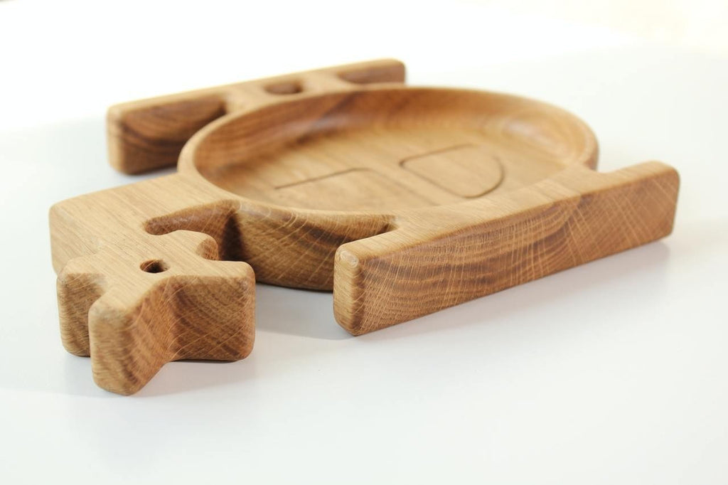 8. Close-up of a wooden helicopter-shaped plate for kids, highlighting the smooth finish and natural wood grain, on a white background