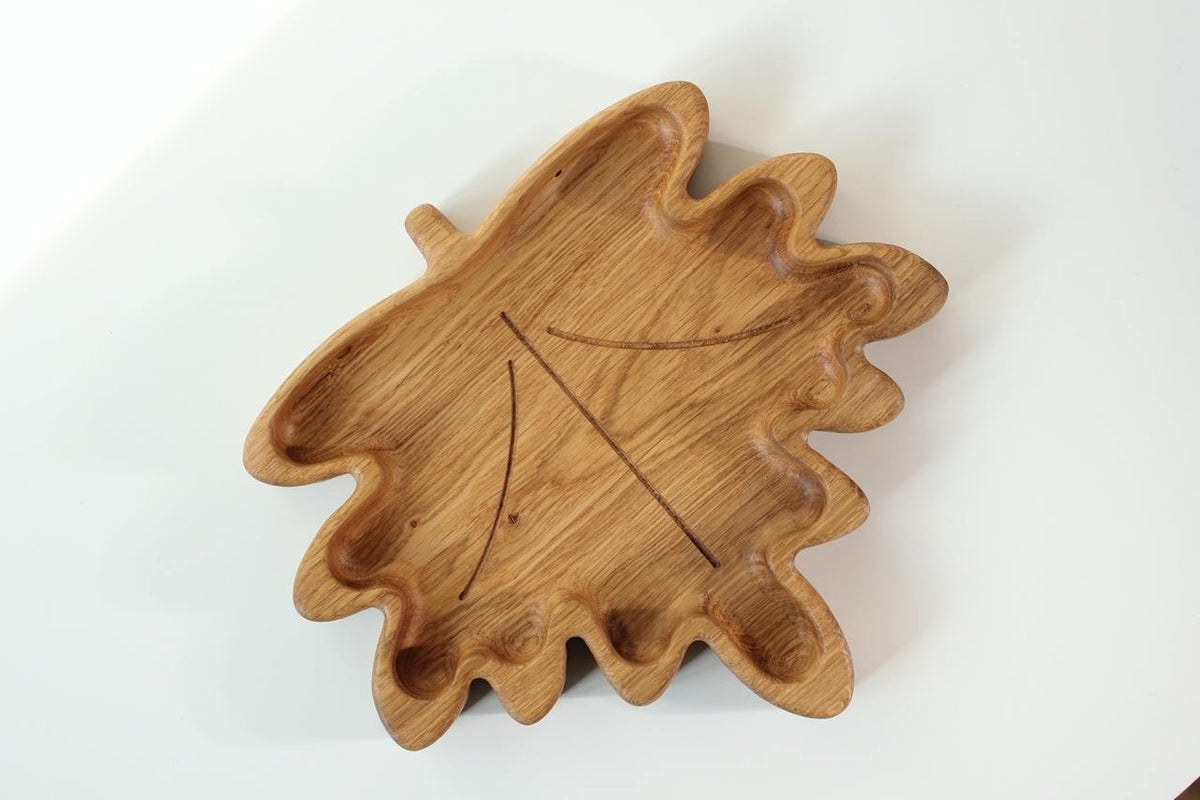 2. Wooden plate for kids in a maple leaf shape, crafted from oak or ash, shown on a white background