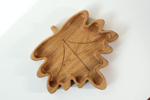 2. Wooden plate for kids in a maple leaf shape, crafted from oak or ash, shown on a white background