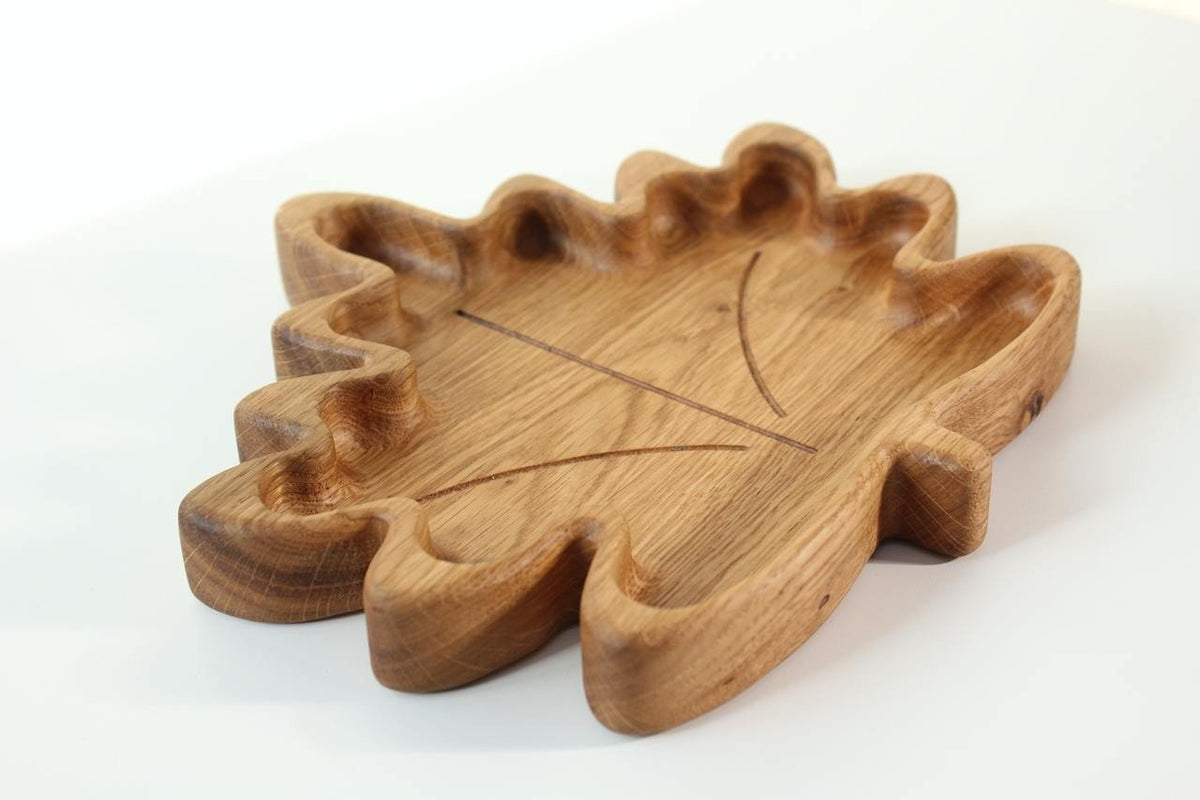 1. Handmade wooden plate for kids in maple leaf shape, crafted from oak or ash, shown on a white background