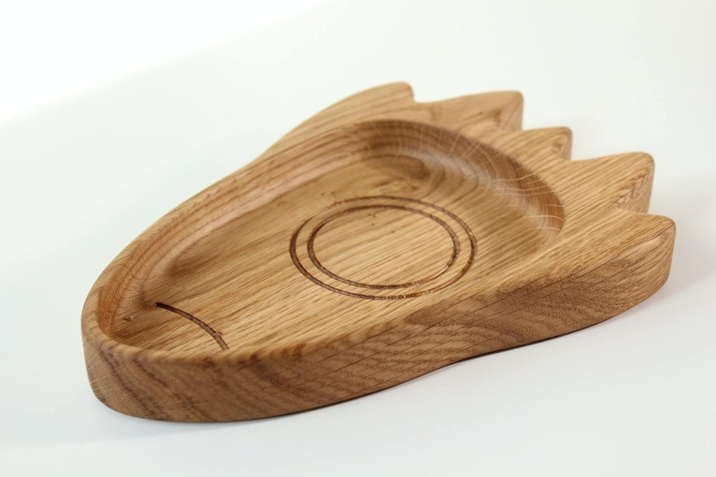 4. Side angle of a wooden rocket-shaped plate for kids, showing the depth and smooth finish of the oak or ash material