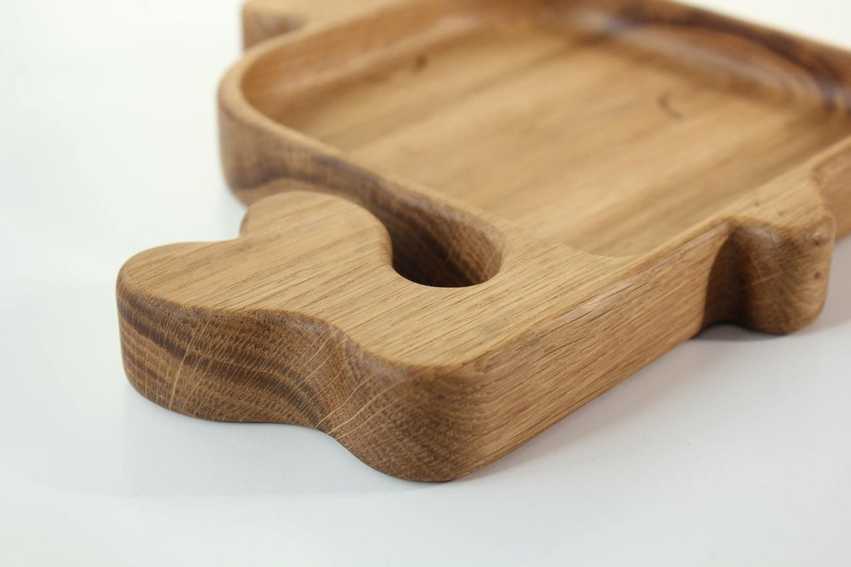 3. Close-up of the tail detail on a wooden whale-shaped plate for kids, showcasing the smooth finish and natural wood texture.