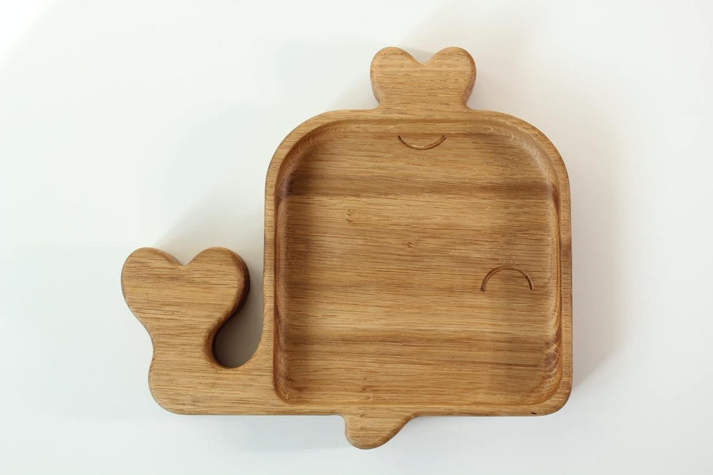 1. Handmade wooden whale-shaped plate for kids made from oak or ash, shown on a white background, highlighting its smooth, polished surface and natural wood grain.