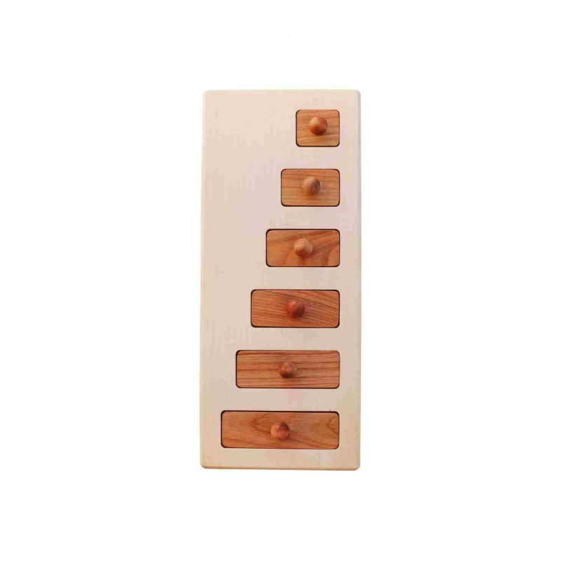 2. Wooden Story puzzle blocks fitted into a wooden base, showcasing varying lengths and knobs, on a white background