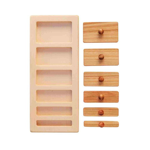 1. Wooden Story puzzle blocks with varying lengths and knobs, shown on a white background