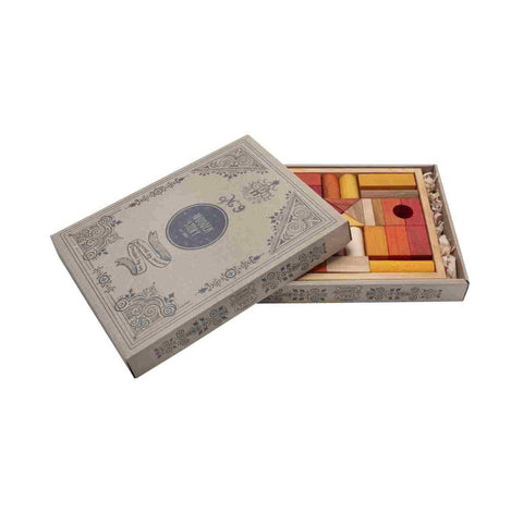 4. Wooden Story warm-colored wooden blocks in an open decorative cardboard box with intricate designs