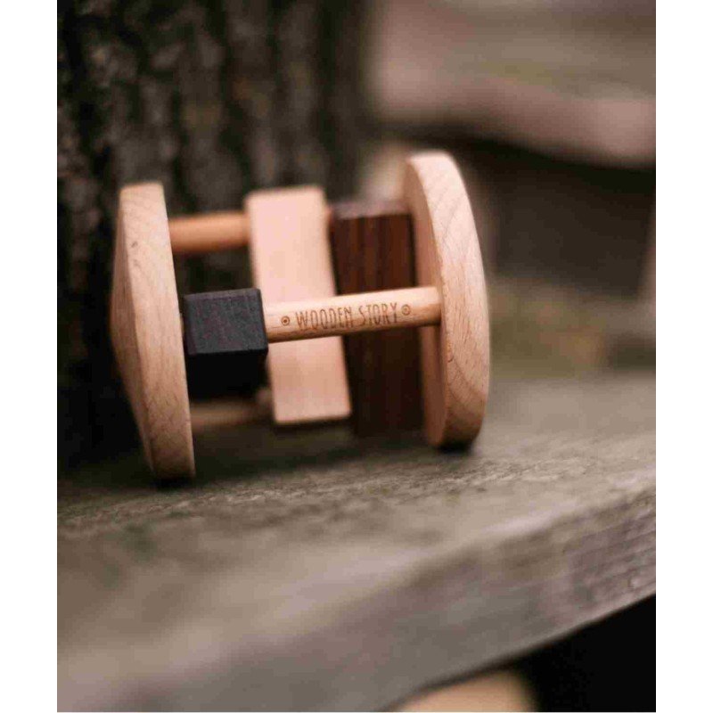 1. Fieldfare wooden rattle by Wooden Story resting on wooden surface outdoors, highlighting natural wood texture