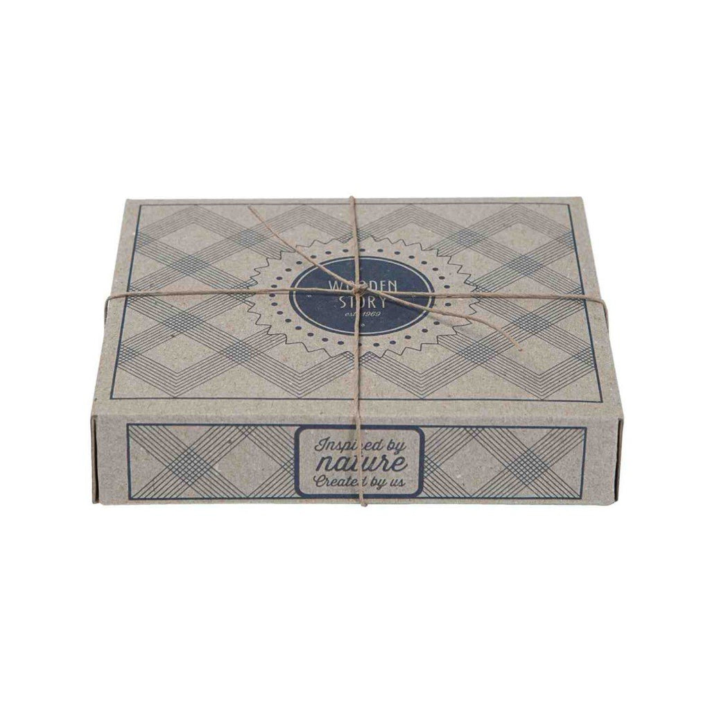 2. Eco-friendly packaging for Wooden Story products, featuring a cardboard box with a geometric pattern and brand logo, tied with natural twine.