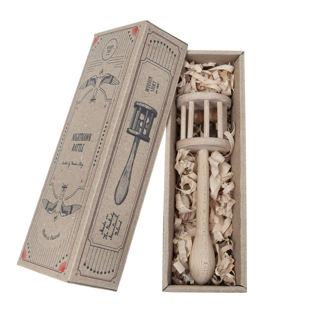 11. Wooden Story rattle in open packaging with shredded paper filling