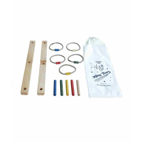 3. Flat lay of wooden ring toss game components including colorful posts, braided rings, and cotton storage bag