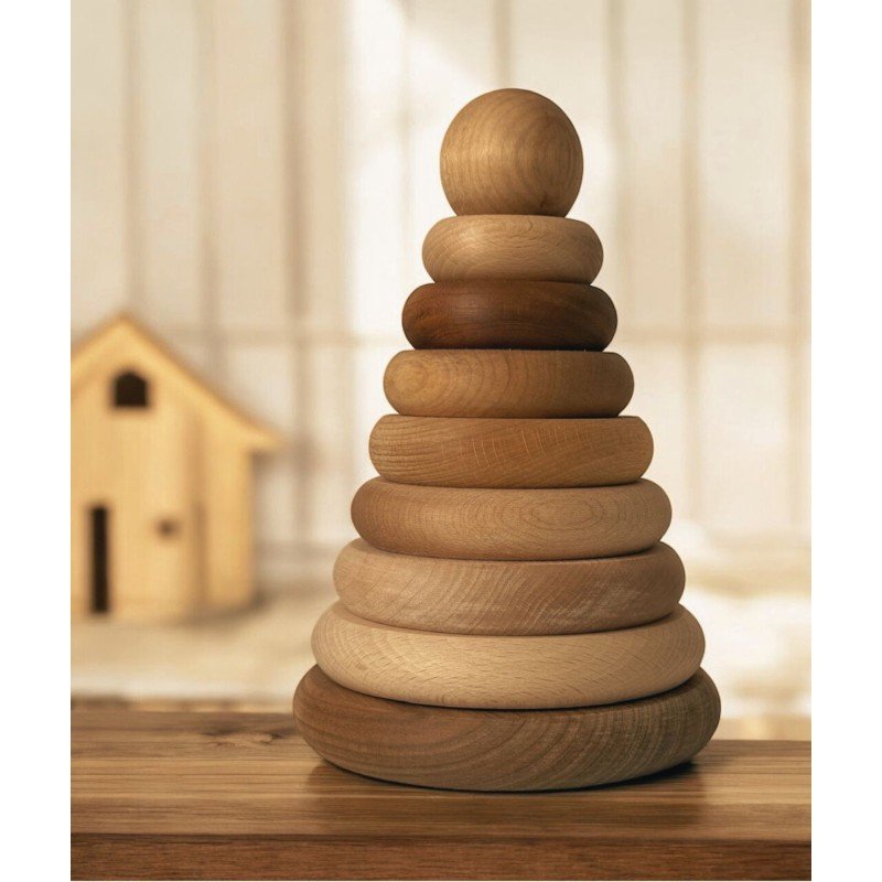 1. Wooden round pyramid toy with natural finish displayed on a wooden surface in a cozy indoor setting