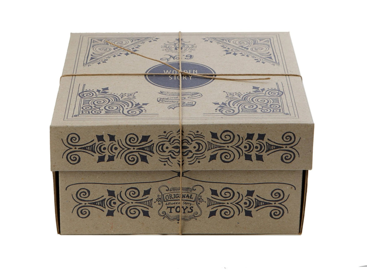 4. Cardboard box packaging for Wooden Story shape sorting blocks with decorative design and twine