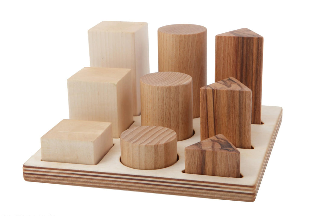 2. Wooden shape sorting blocks in natural wood colors on a wooden board, featuring various geometric shapes and sizes