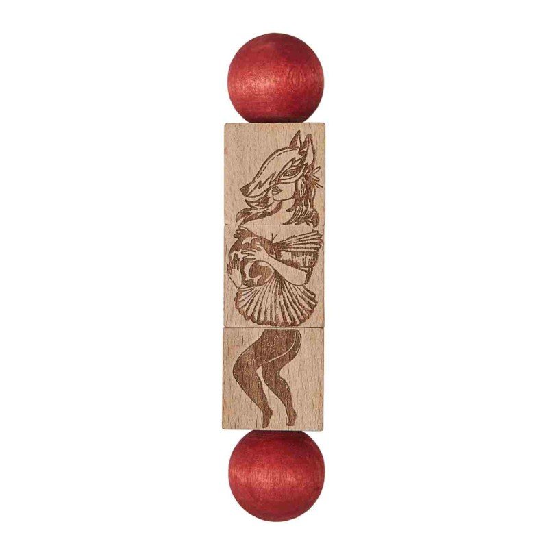 3. Close-up of Commedia Dell'Arte wooden spinning puzzle with engraved character and red end pieces