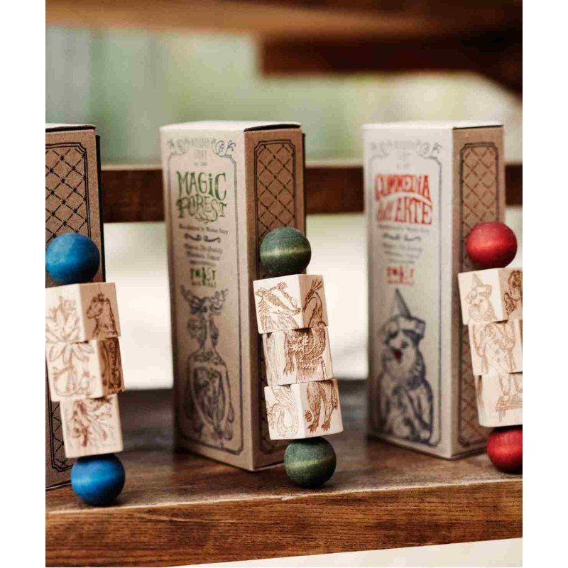 4. Three wooden spinning puzzles with colorful ends displayed on wooden shelf