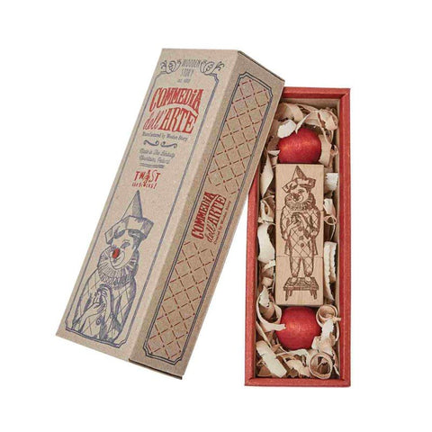 2. Commedia Dell'Arte wooden spinning puzzle in open box with decorative packaging