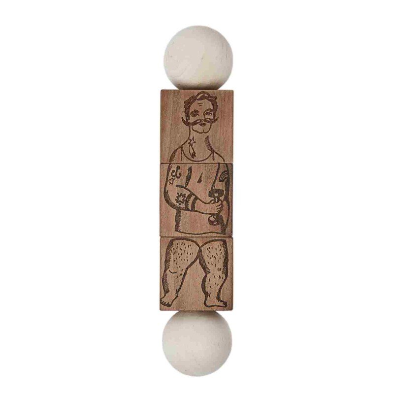 2. Wooden Story Commedia Dell'Arte wooden spinning puzzle with natural finish, featuring engraved character design, shown in studio setting