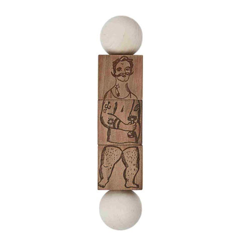 2. Wooden Story Commedia Dell'Arte wooden spinning puzzle with natural finish, featuring engraved character design, shown in studio setting