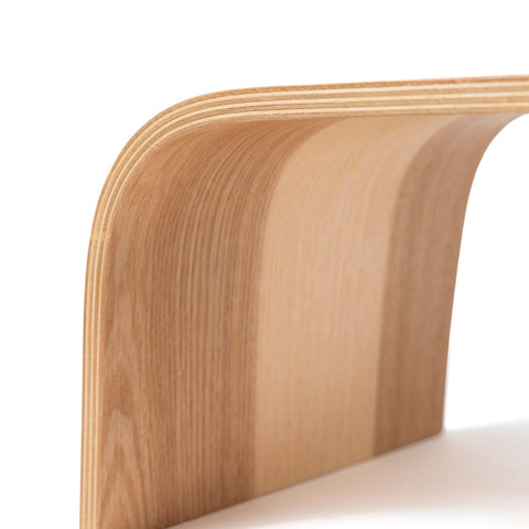 3. Close-up of wooden step stool's curved side, highlighting smooth birch plywood layers
