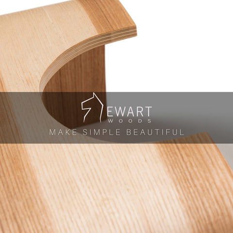 2. Detail of Ewart Woods logo on wooden step stool with text 'Make Simple Beautiful'