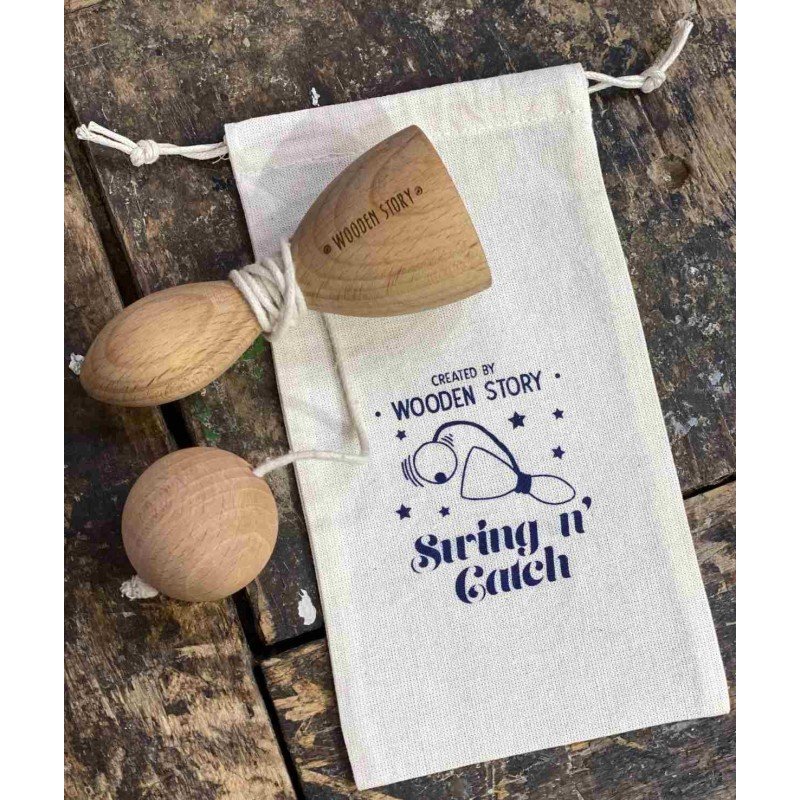 2. Wooden Swing and Catch game on rustic wooden surface with branded cotton bag