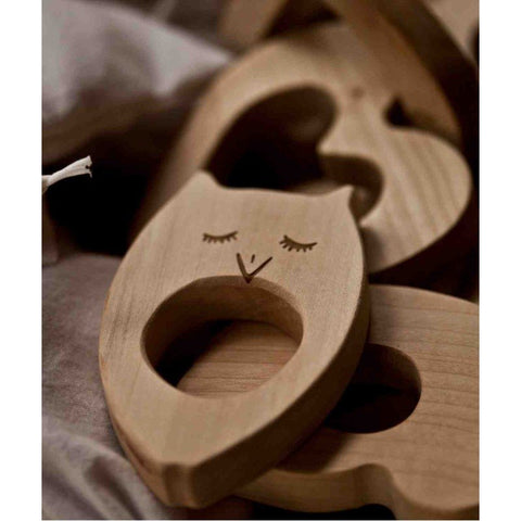 2. Close-up of Wooden Story teddy bear-shaped wooden teether in natural maple wood, highlighting the smooth finish and ergonomic design.