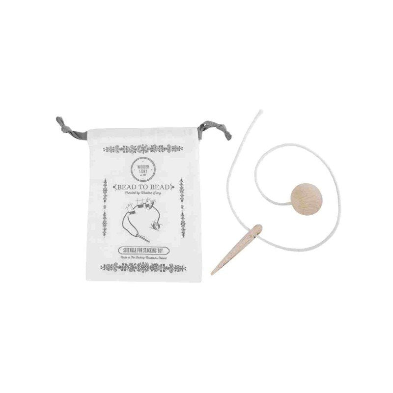4. Flat lay of Wooden Story threading needle with cotton string and branded cotton bag