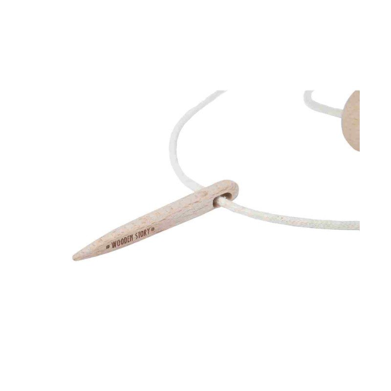 3. Close-up of Wooden Story threading needle with logo on cotton string