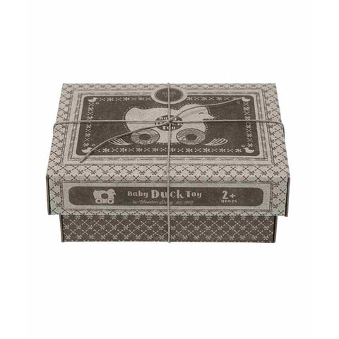 4. Cardboard packaging for Wooden Story duck toy with vintage design and string tie