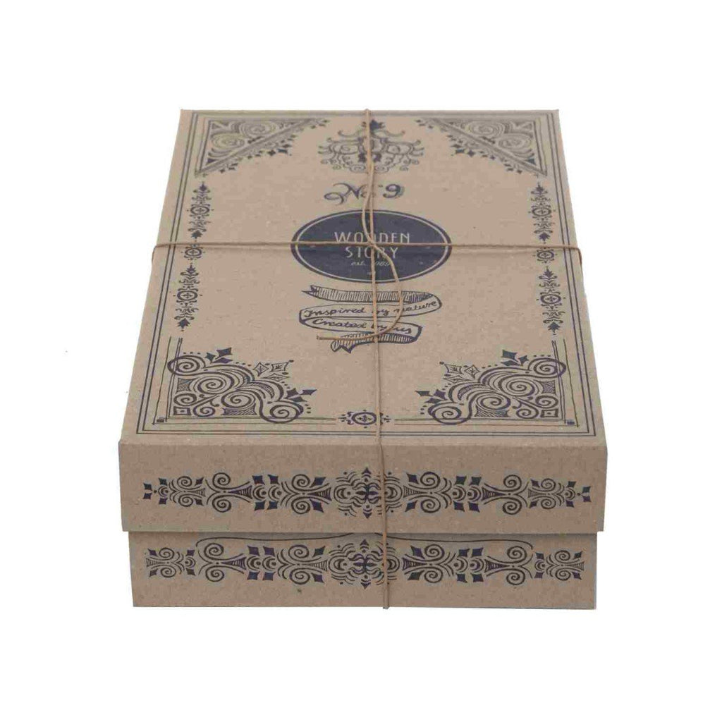 4. Decorative Wooden Story packaging box with intricate designs and branding, tied with string