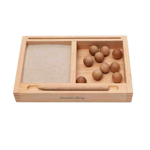 4. Montessori sand writing tray with sand section and wooden balls, includes a wooden pencil, branded with Wooden Story logo.