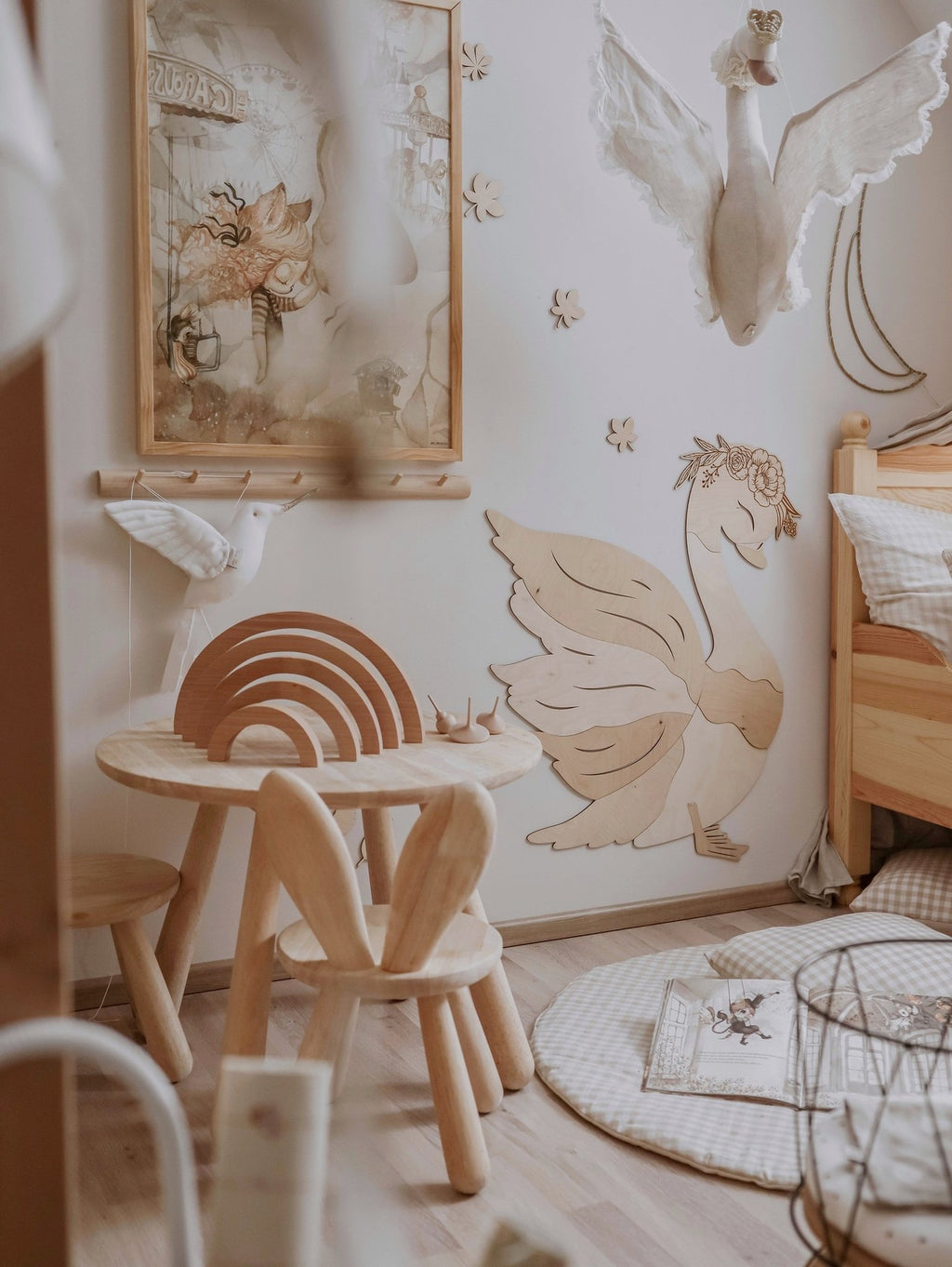 1. Wooden swan wall decoration in a cozy children's room with wooden furniture and soft textiles