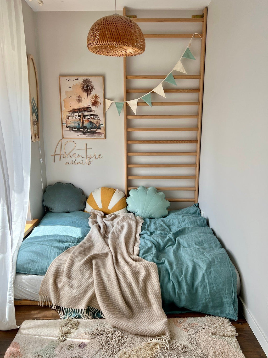 7. Cozy child's room with 'Adventure Awaits' wooden sign, colorful pillows, and decorative bunting