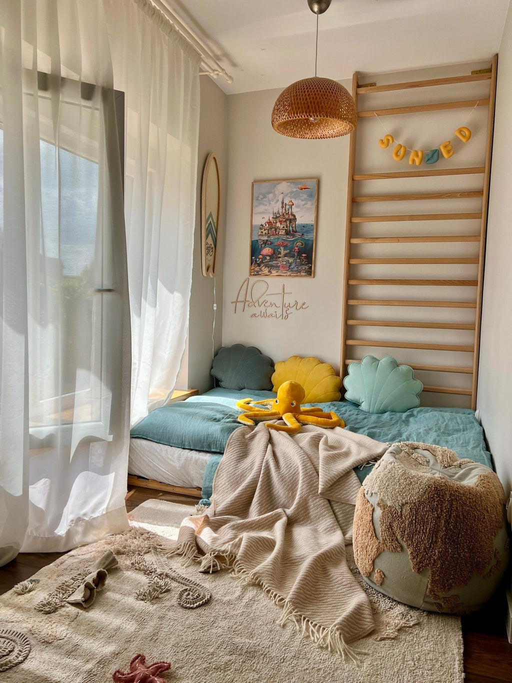 6. Child's room with 'Adventure Awaits' wooden sign, fantasy artwork, and cozy bedding